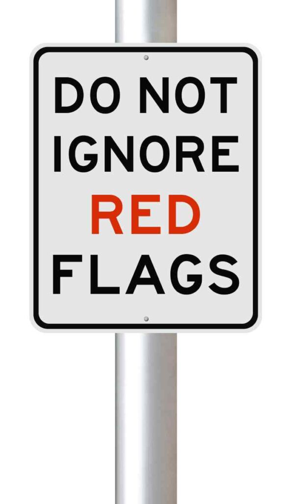 A sign that reads “do not ignore red flags”
